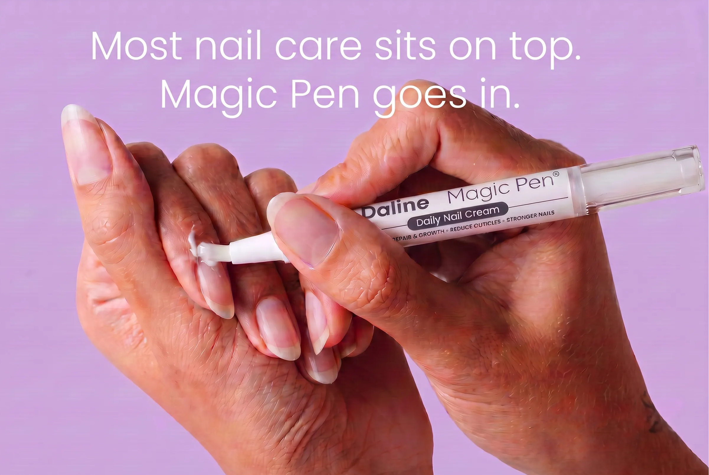 A close-up of a hand holding a Daline Magic Pen nail cream applicator against a solid lavender background, with text at the top reading 'Most nail care sits on top. Magic Pen goes in.